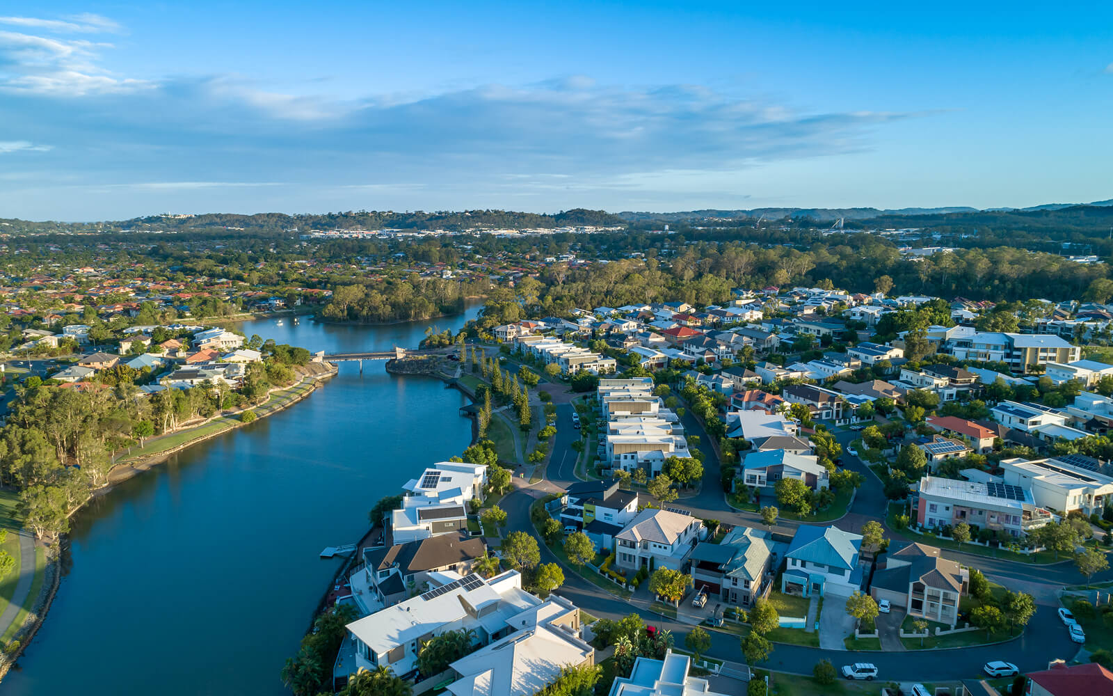 Aerial view of Gold Coast riverside suburbs on a clear day