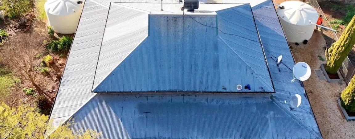 Before: Metal roof